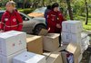URCS volunteers distributing aid to victims of Russian drone attack in Dnipro